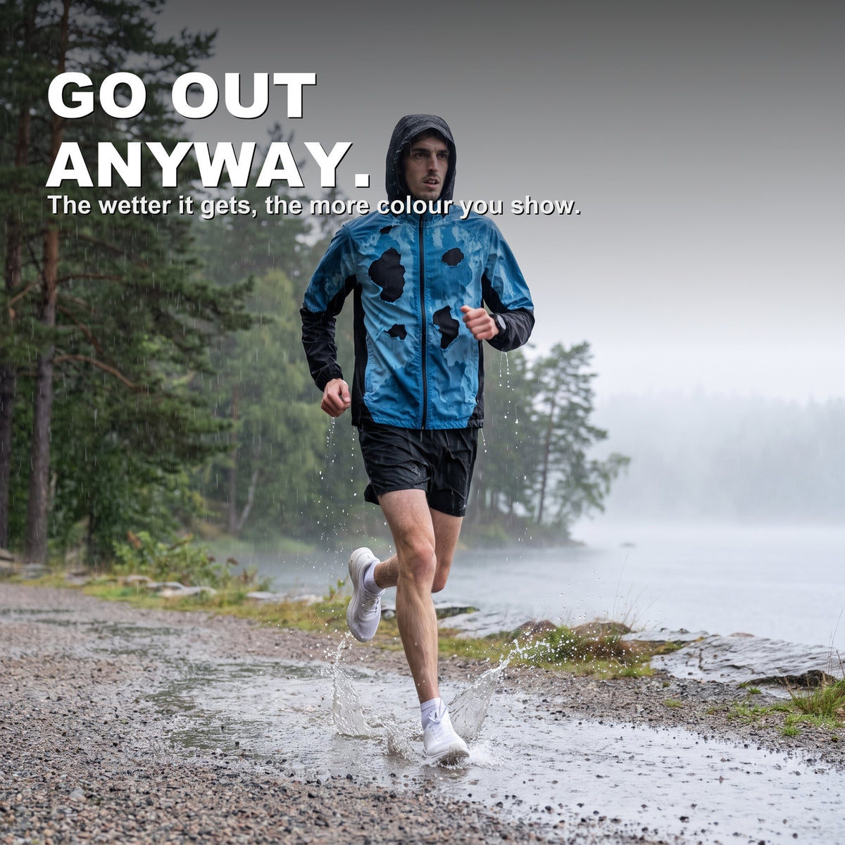 BLOOMTRACK rain-reactive jacket revealed blue on a rainy lakeside run