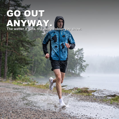 BLOOMTRACK rain-reactive jacket revealed blue on a rainy lakeside run