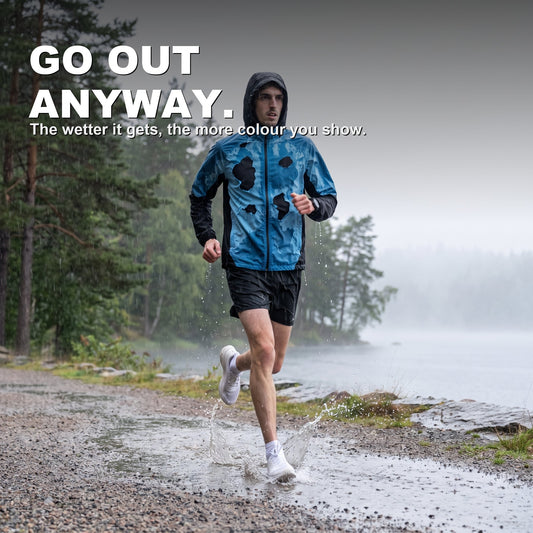 BLOOMTRACK rain-reactive jacket revealed blue on a rainy lakeside run