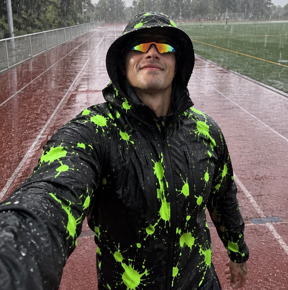 Runner on a wet track, jacket revealed green